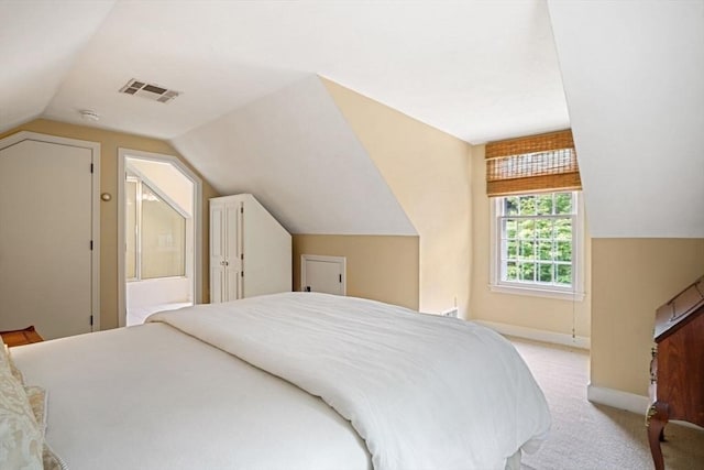 10 Queen Anne Rd, Hopkinton, MA 01748 - carpeted bedroom featuring lofted ceiling, visible vents, and baseboards