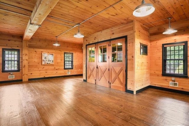10 Queen Anne Rd, Hopkinton, MA 01748 - empty room featuring wooden ceiling, plenty of natural light, and hardwood / wood-style floors