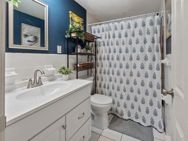 full bathroom with tile patterned flooring, toilet, tile walls, vanity, and a shower with shower curtain