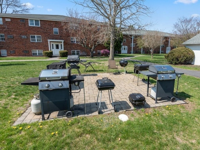 view of property's community with a yard and a patio area