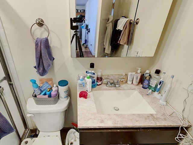 bathroom with vanity and toilet