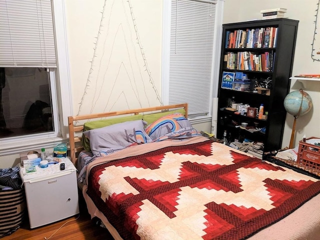 bedroom featuring wood finished floors