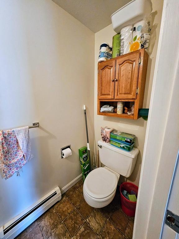 12 Chadwick Ct Unit 12, Amherst, MA 01002 - bathroom featuring baseboard heating and toilet