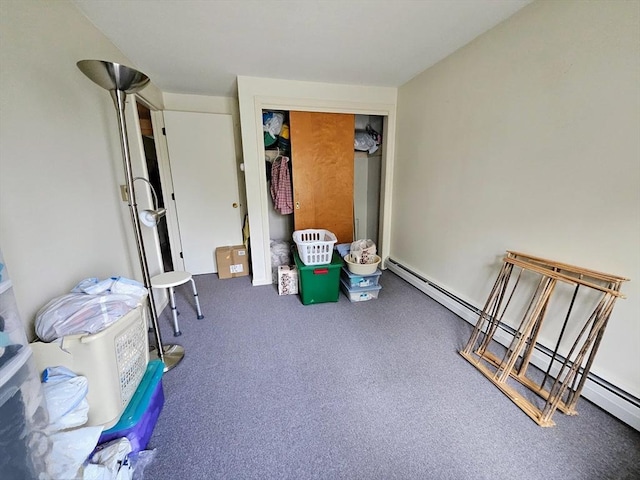 12 Chadwick Ct Unit 12, Amherst, MA 01002 - bedroom with a baseboard heating unit, carpet flooring, and a closet