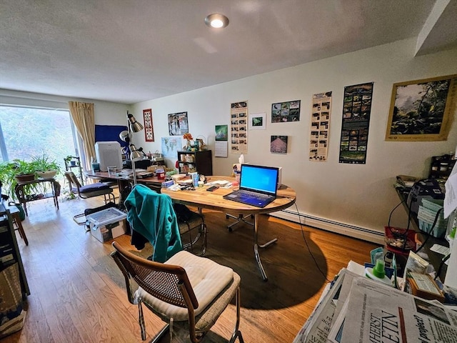 12 Chadwick Ct Unit 12, Amherst, MA 01002 - office space featuring a baseboard radiator and wood finished floors