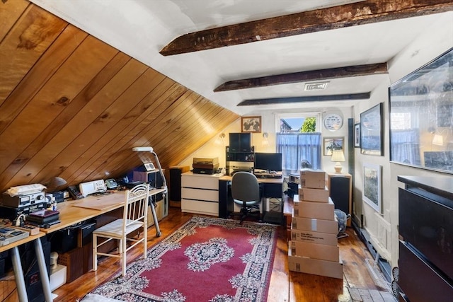 office area featuring wood finished floors, visible vents, and vaulted ceiling with beams