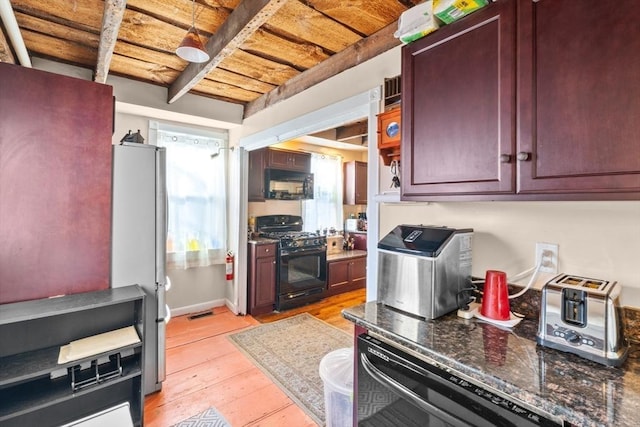 kitchen featuring wood ceiling, black appliances, light wood-style floors, and reddish brown cabinets