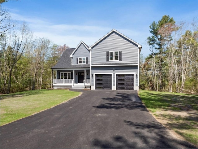 view of front of home with driveway, a garage, a shingled roof, covered porch, and a front yard