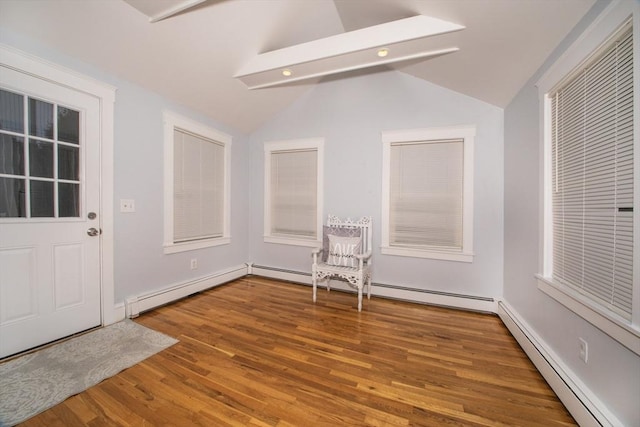 interior space featuring baseboard heating and vaulted ceiling