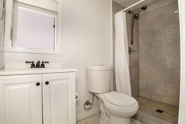 bathroom with vanity, toilet, and walk in shower