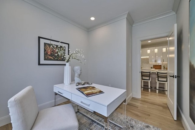 office featuring ornamental molding, recessed lighting, light wood-style flooring, and baseboards