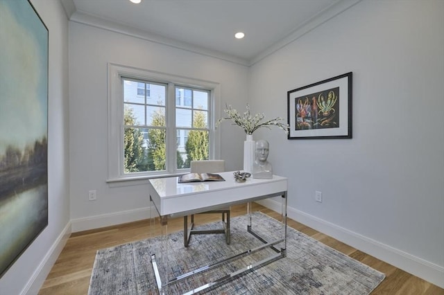 office with crown molding, baseboards, and wood finished floors