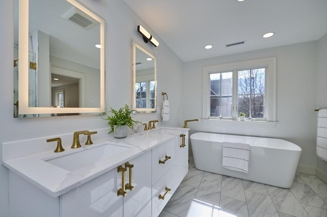 full bathroom featuring marble finish floor, visible vents, and plenty of natural light