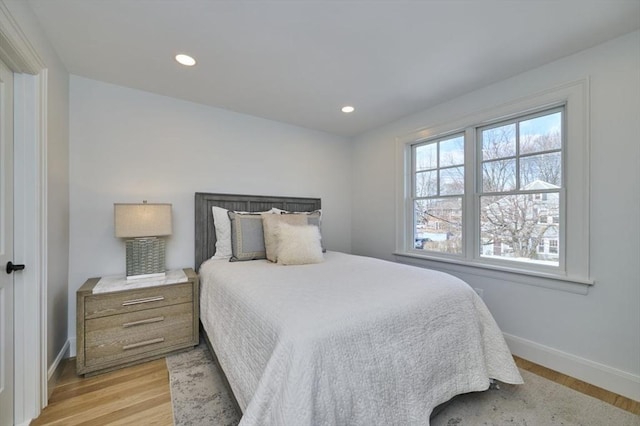 bedroom featuring light wood-type flooring, baseboards, and recessed lighting