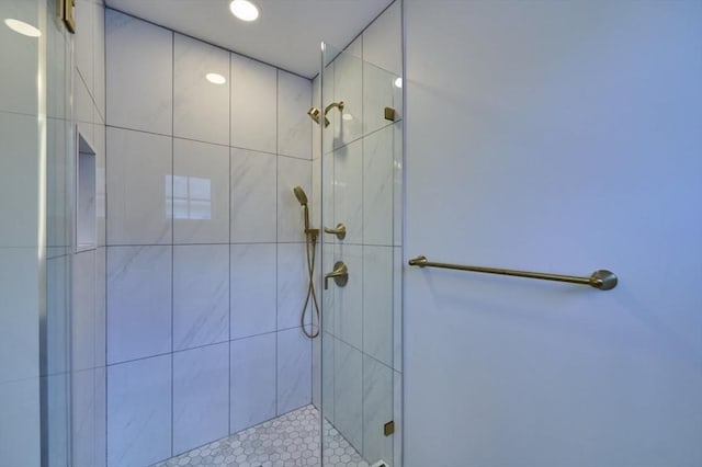 full bathroom with a tile shower