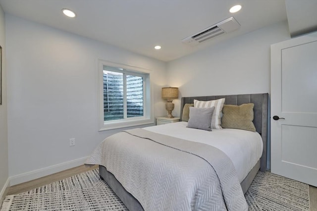 bedroom featuring recessed lighting, light wood-style flooring, and baseboards