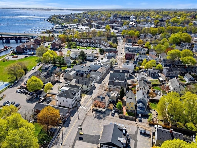 drone / aerial view featuring a water view and a residential view