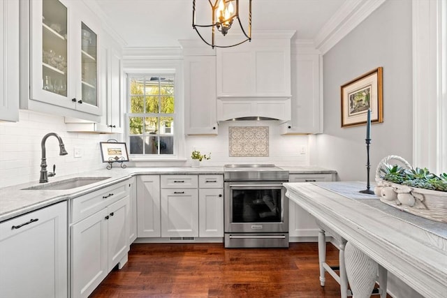kitchen featuring crown molding, white cabinets, stainless steel electric range, a sink, and glass insert cabinets