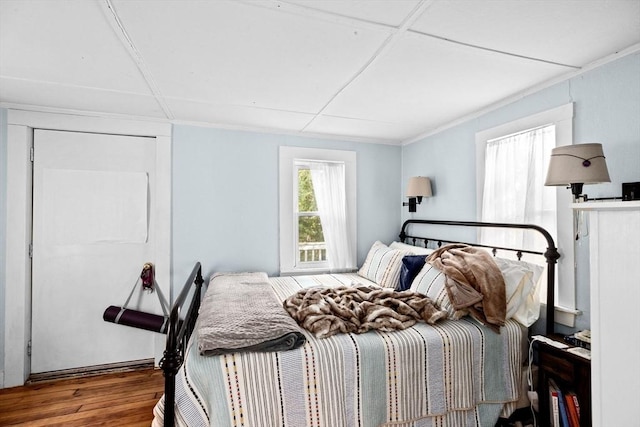 bedroom with wood finished floors