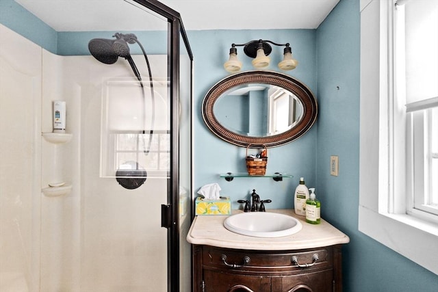 full bath featuring a stall shower and vanity