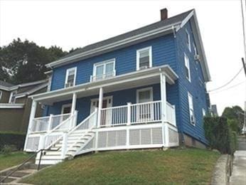471 Broadway, Lynn, MA 01904 - view of front facade with a porch, stairway, a front lawn, and a chimney