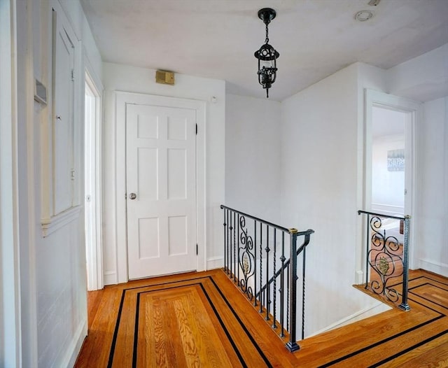 hallway featuring an upstairs landing