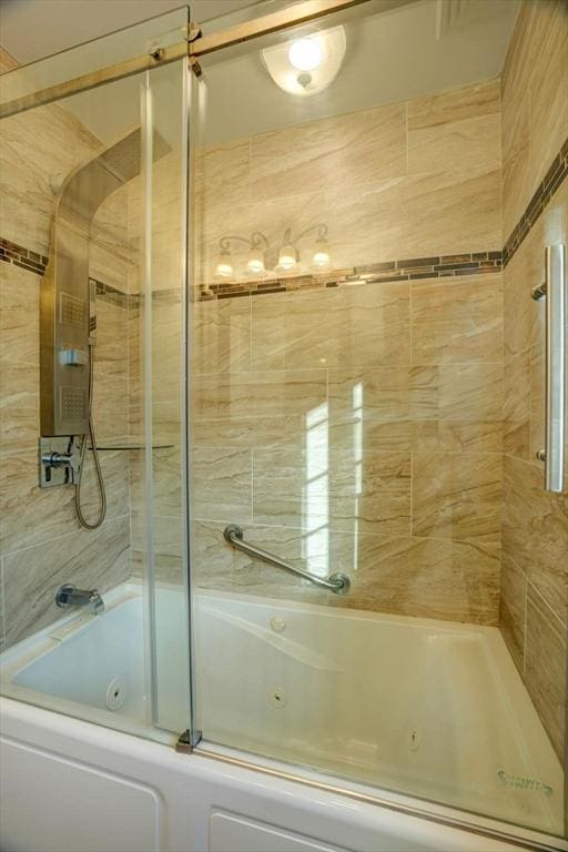 bathroom with a combined bath / shower with jetted tub