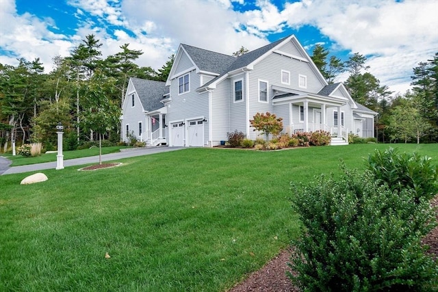 view of front facade with a garage and a front yard