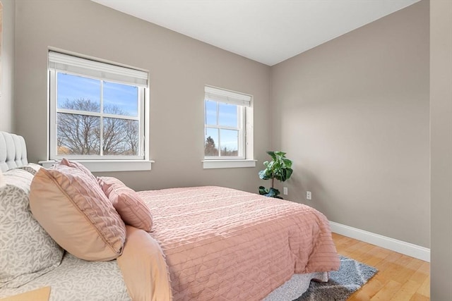 bedroom with light hardwood / wood-style floors