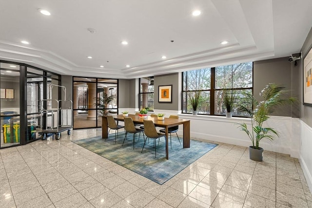 dining space with a tray ceiling