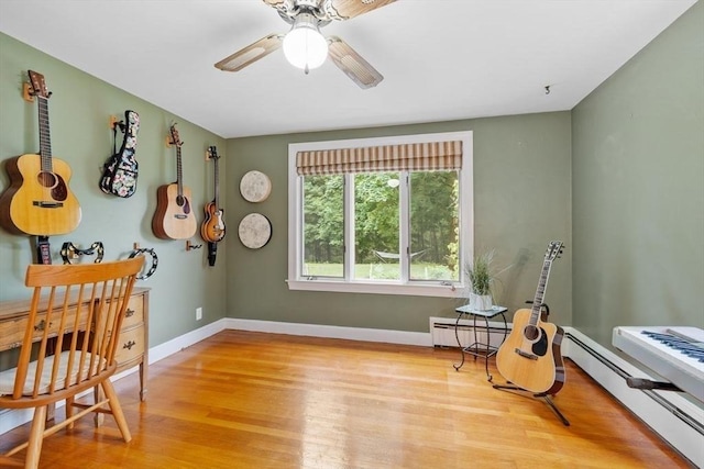 20 Chandler Rd, Andover, MA 01810 - living area with wood finished floors, ceiling fan, and baseboard heating