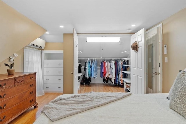 20 Chandler Rd, Andover, MA 01810 - bedroom featuring an AC wall unit, light wood finished floors, a closet, and recessed lighting