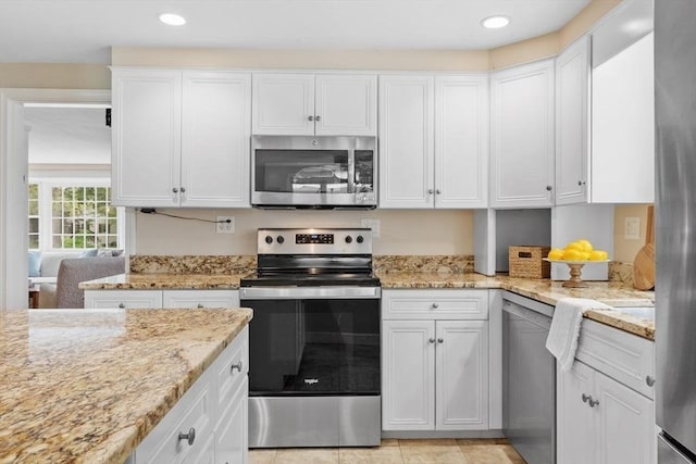 20 Chandler Rd, Andover, MA 01810 - kitchen featuring appliances with stainless steel finishes, white cabinetry, light stone countertops, and recessed lighting