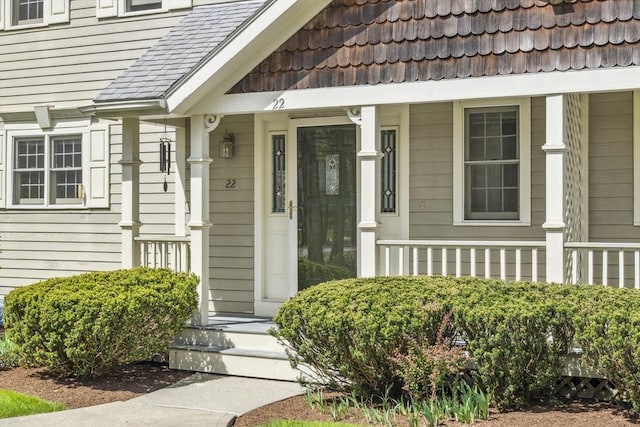 property entrance featuring a porch