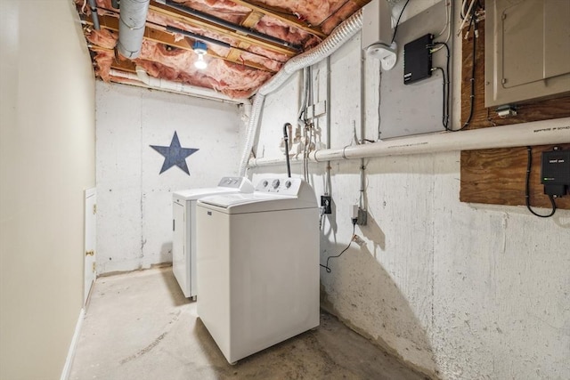laundry area with laundry area, washing machine and dryer, and electric panel