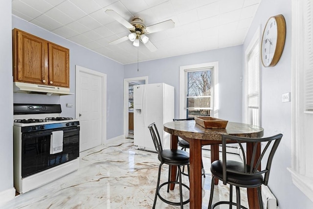 kitchen with ceiling fan and white appliances