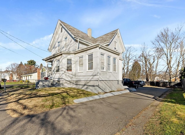 view of property exterior with a yard