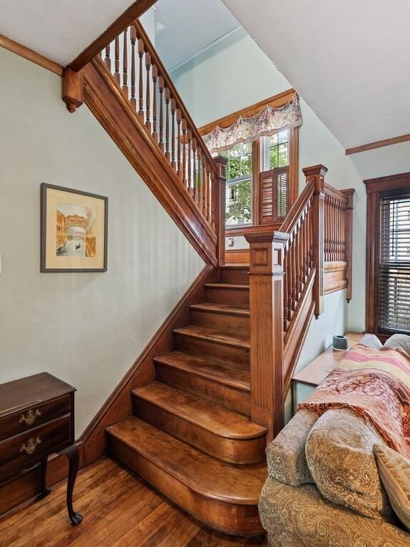 staircase featuring wood finished floors