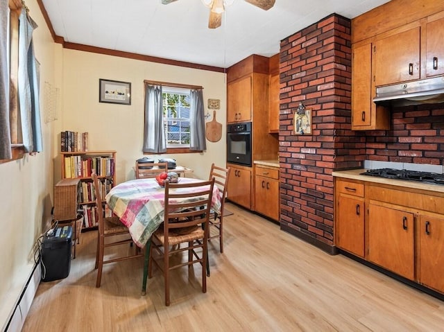 dining room with ceiling fan, ornamental molding, light wood finished floors, and a baseboard radiator