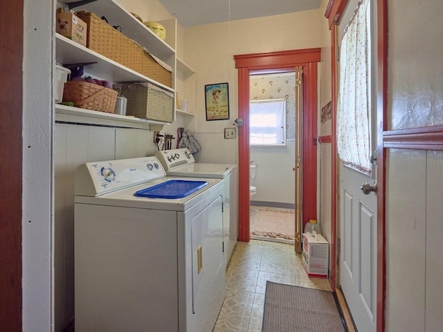 laundry room featuring laundry area and separate washer and dryer