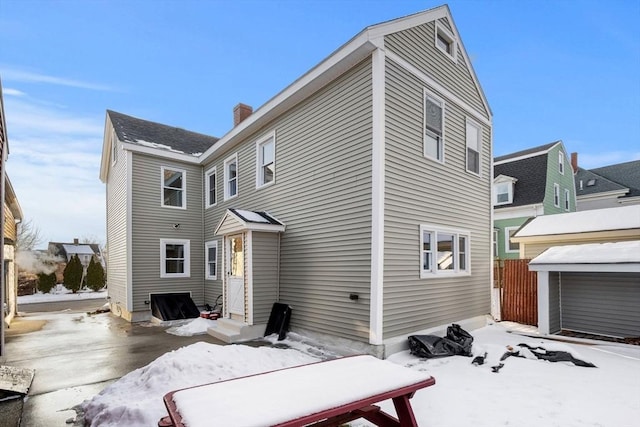 view of snow covered house