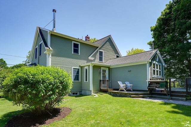 21 Mechanic St, Holliston, MA 01746 - back of property featuring a deck, a chimney, a lawn, and a shingled roof