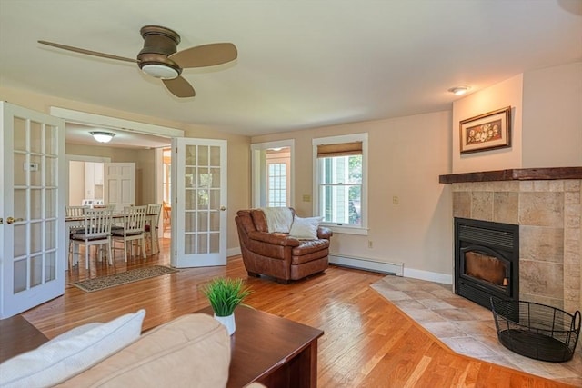 21 Mechanic St, Holliston, MA 01746 - living room with baseboard heating, french doors, wood finished floors, and ceiling fan