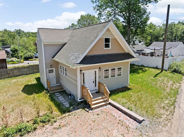 69 Wood St, Hanson, MA 02341 - view of front facade with a shingled roof