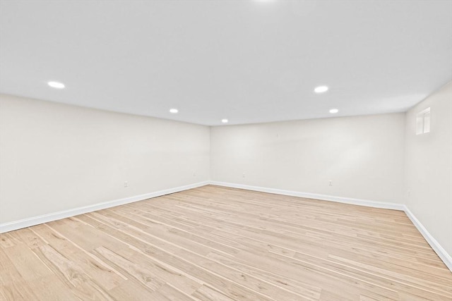69 Wood St, Hanson, MA 02341 - empty room with light wood finished floors and recessed lighting