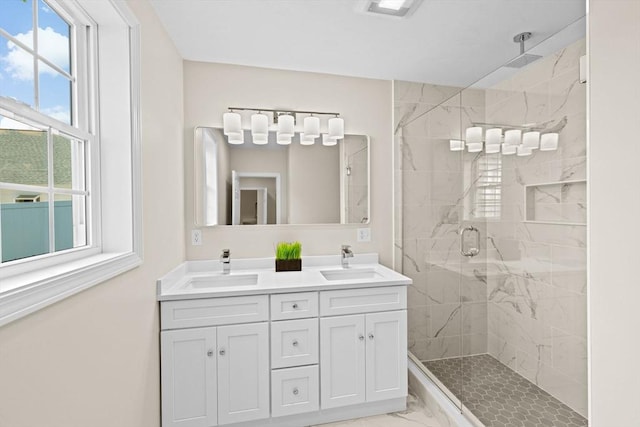 69 Wood St, Hanson, MA 02341 - full bathroom featuring marble look tiles, a stall shower, and double vanity