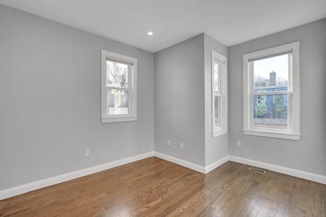 empty room featuring hardwood / wood-style floors