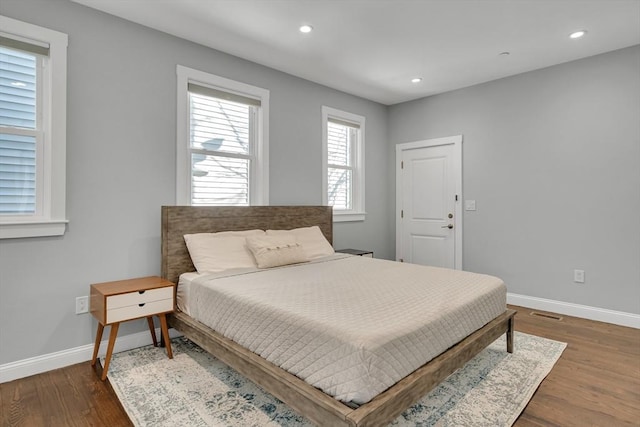 bedroom featuring dark hardwood / wood-style floors