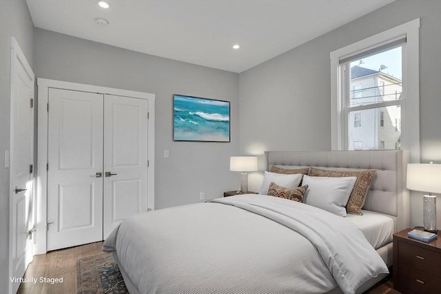 bedroom with a closet and wood-type flooring