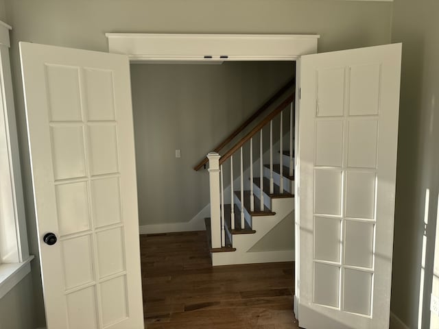 stairway featuring wood-type flooring